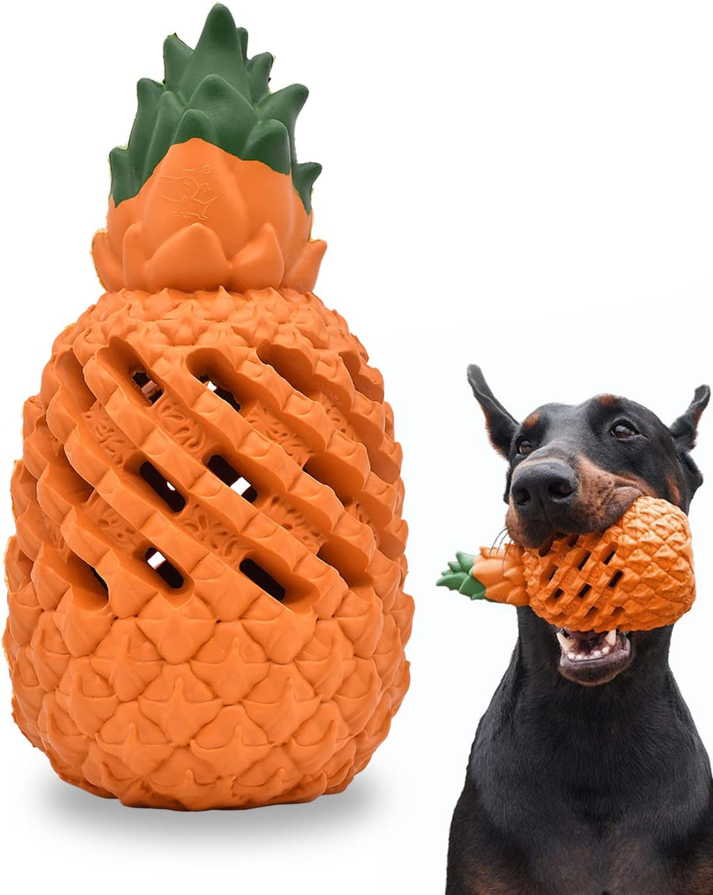 Bedrock Rubber Chew in orange natural rubber, shaped like a pineapple, showing the ribbed surface and the open lattice channels through the body, beside a Doberman carrying one