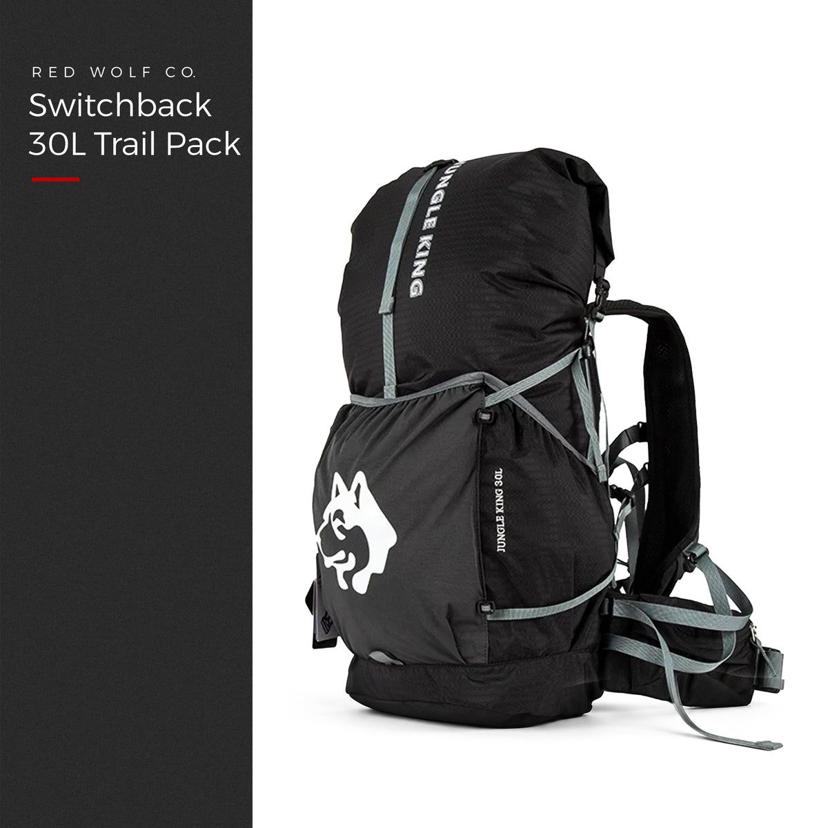 Blackout — Switchback 30L Trail Pack from the front three-quarter, roll-top closed, grey compression straps and padded hip belt, under a Red Wolf Co. title panel