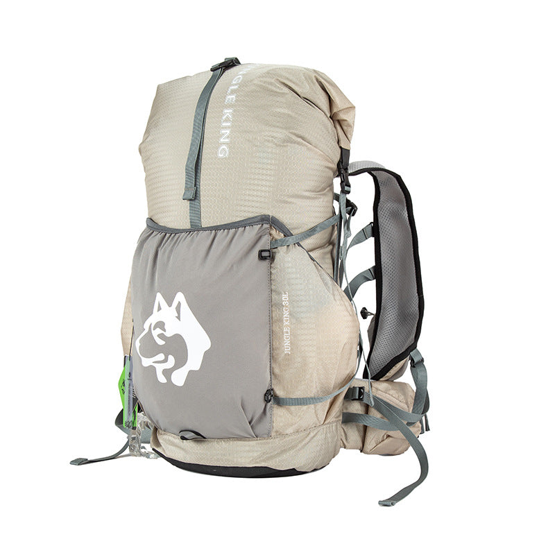 Fog Grey — Switchback 30L Trail Pack from the front three-quarter, roll-top lid closed, with the stretch front pocket and padded hip belt