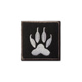 Embroidered white dog claw print patch on black twill backing, shown square-on against a white background